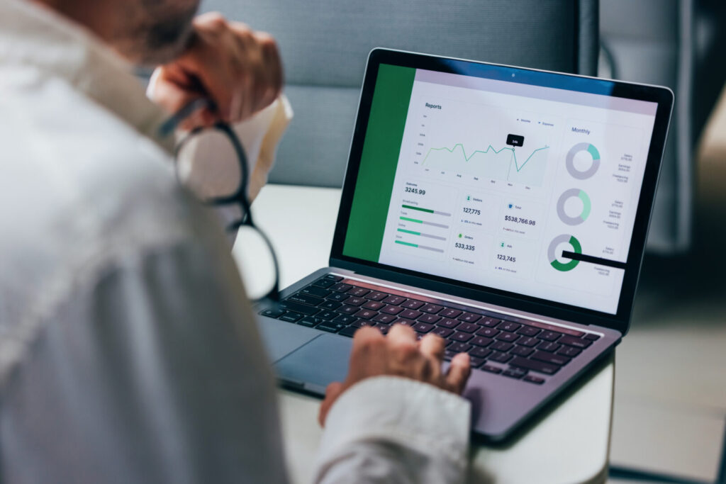 Professional Analyzing Business Data on Laptop with Graphical Charts and Reports 4 Insights 1024x683