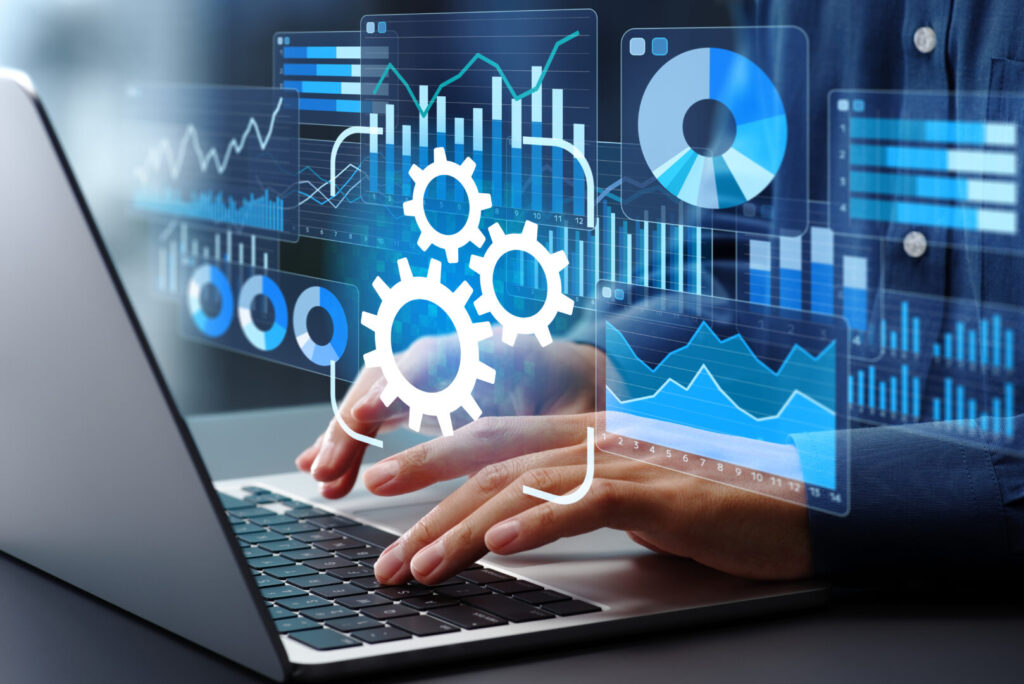 Automated reporting and business intelligence. Data automation and dashboards. Businessman using laptop computer to generate and monitor real-time reports. 8 Insights 1024x684